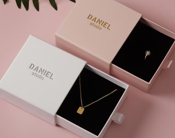 Pink and white slide box with necklace and earrings